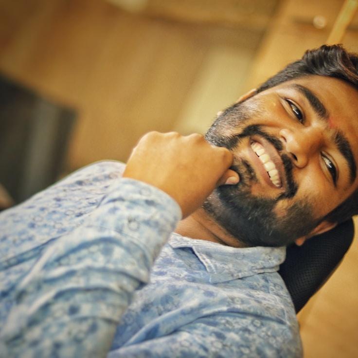 Ariya Solanki, Head Design Curator at NomadVividFlux, reviewing corporate floral arrangements